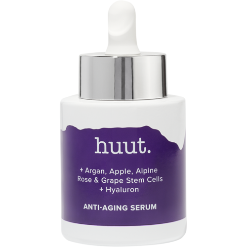 Weiße Flasche mit lila Etikett, Aufschrift huut, Anti-Aging Serum. Weiße Flasche mit lila Etikett, Aufschrift huut, Anti-Aging Serum.