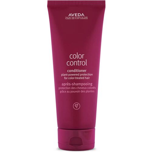Rote Conditioner-Flasche von Aveda für coloriertes Haar. Rote Conditioner-Flasche von Aveda für coloriertes Haar.