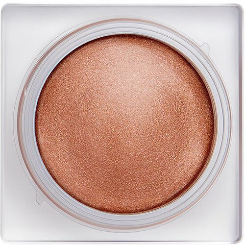 Runde Creme in goldener Farbe in einem quadratischen, transparenten Behälter.