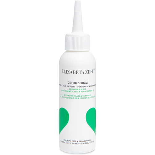 Weiße Flasche Detox-Serum mit grünen Details und Textaufdruck auf Vorderseite.