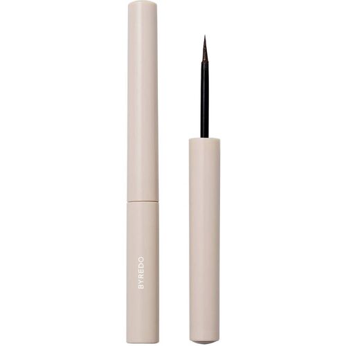 Flüssiger Eyeliner in beiger Verpackung, geöffneter Kappe, feine Spitze. Flüssiger Eyeliner in beiger Verpackung, geöffneter Kappe, feine Spitze.