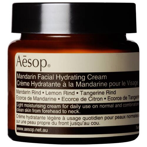 Braunes Glasgefäß mit Aesop Mandarin Facial Hydrating Cream Etikett.