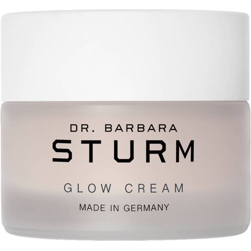 Creme im transparenten Tiegel mit weißem Deckel und schwarzer Aufschrift.