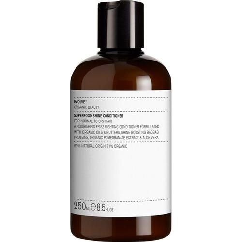 Braune Conditioner-Flasche mit weißem Etikett und schwarzem Verschluss.