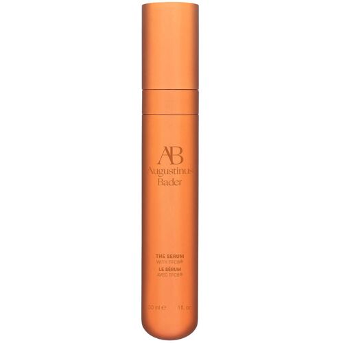 Orange Flasche eines Serums mit Augustinus Bader Logo und Schriftzug.