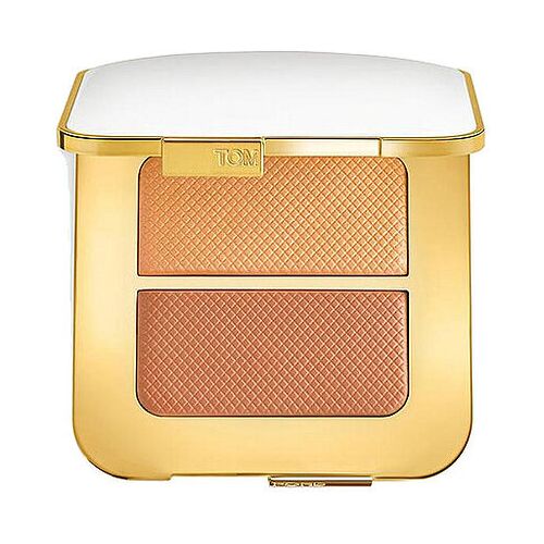 Goldene Kosmetikverpackung mit zwei bronzefarbenen Pudern auf weißem Hintergrund. Goldene Kosmetikverpackung mit zwei bronzefarbenen Pudern auf weißem Hintergrund.
