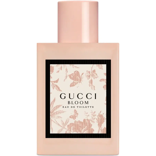 Rechteckige rosa Flasche mit floralem Muster und Gucci Bloom Aufschrift.