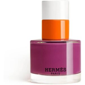 Runde Parfümflasche von Hermès mit lila Körper und orange-weißem Verschluss.