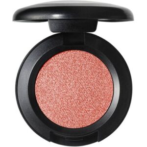 Runde Lidschatten-Verpackung mit geöffneter schwarzer Hülle, zeigt glitzernde rote Oberfläche.