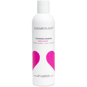 Weiße Shampoo-Flasche mit pinkem Design und Text für extra Volumen.