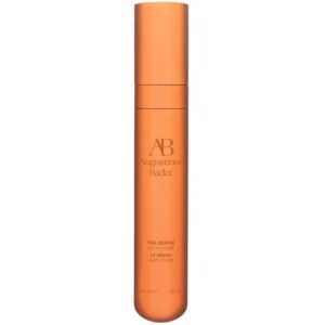 Orange Flasche eines Serums mit Augustinus Bader Logo und Schriftzug.