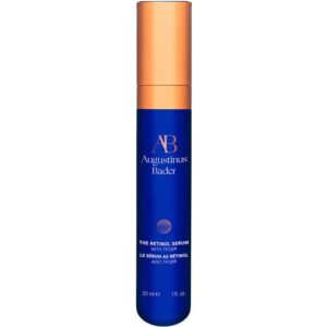 Blaue Flasche mit orangefarbenem Deckel, Augustinus Bader Retinol Serum Aufschrift.