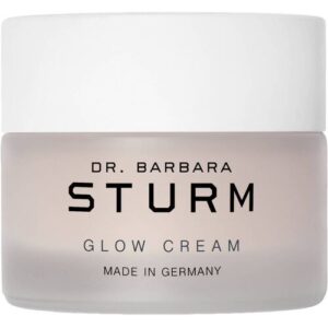 Creme im transparenten Tiegel mit weißem Deckel und schwarzer Aufschrift.