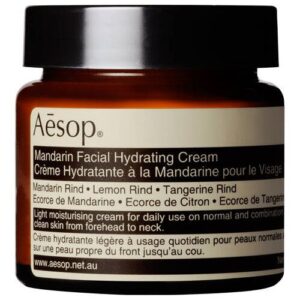 Braunes Glasgefäß mit Aesop Mandarin Facial Hydrating Cream Etikett.