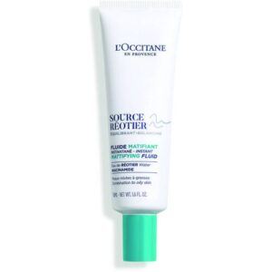 Weiße Tube mit grünem Deckel, L'Occitane Produktaufdruck.