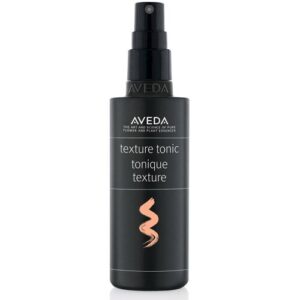 Schwarze Aveda Texture Tonic Sprühflasche mit goldenem Logo und Text.