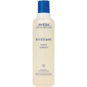 Transparente Shampooflasche von Aveda, blaue Details und Text auf der Vorderseite.