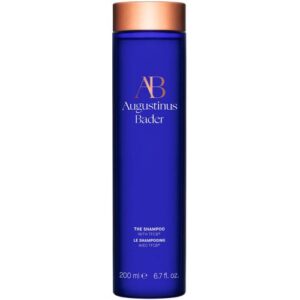 Blaue Shampoo-Flasche von Augustinus Bader mit Kupferdeckel.