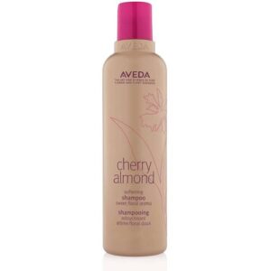 Beigefarbene Shampooflasche mit pinkem Deckel und floralem Design.