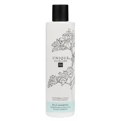Shampooflasche mit Pflanzenmuster und schwarzem Verschluss.