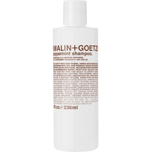 Weiße Flasche Malin+Goetz Pfefferminz Shampoo mit brauner Schrift vor weißem Hintergrund.
