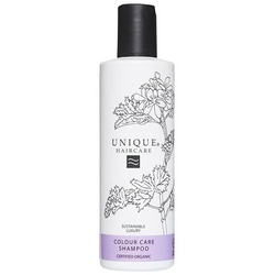 Weiße Shampoo-Flasche mit Pflanzenmuster und schwarzem Deckel.