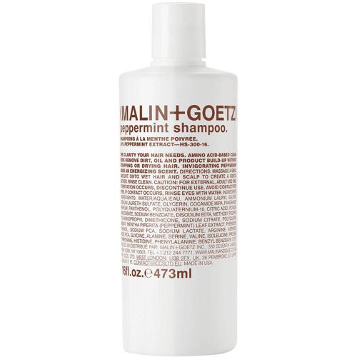 Weiße Shampooflasche mit Textaufdruck und Pefferminzbeschreibung.
